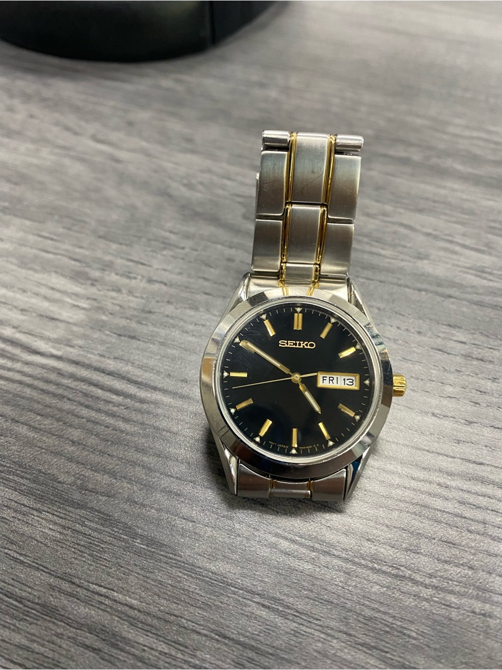 Seiko Two-Tone Black Dial Men's Watch with Gold Accents